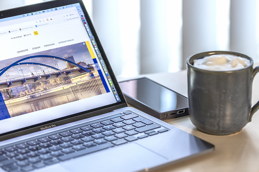 Picture of laptop, cup of coffee, mobile phone